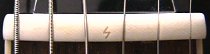 Shelf nut installed on guitar